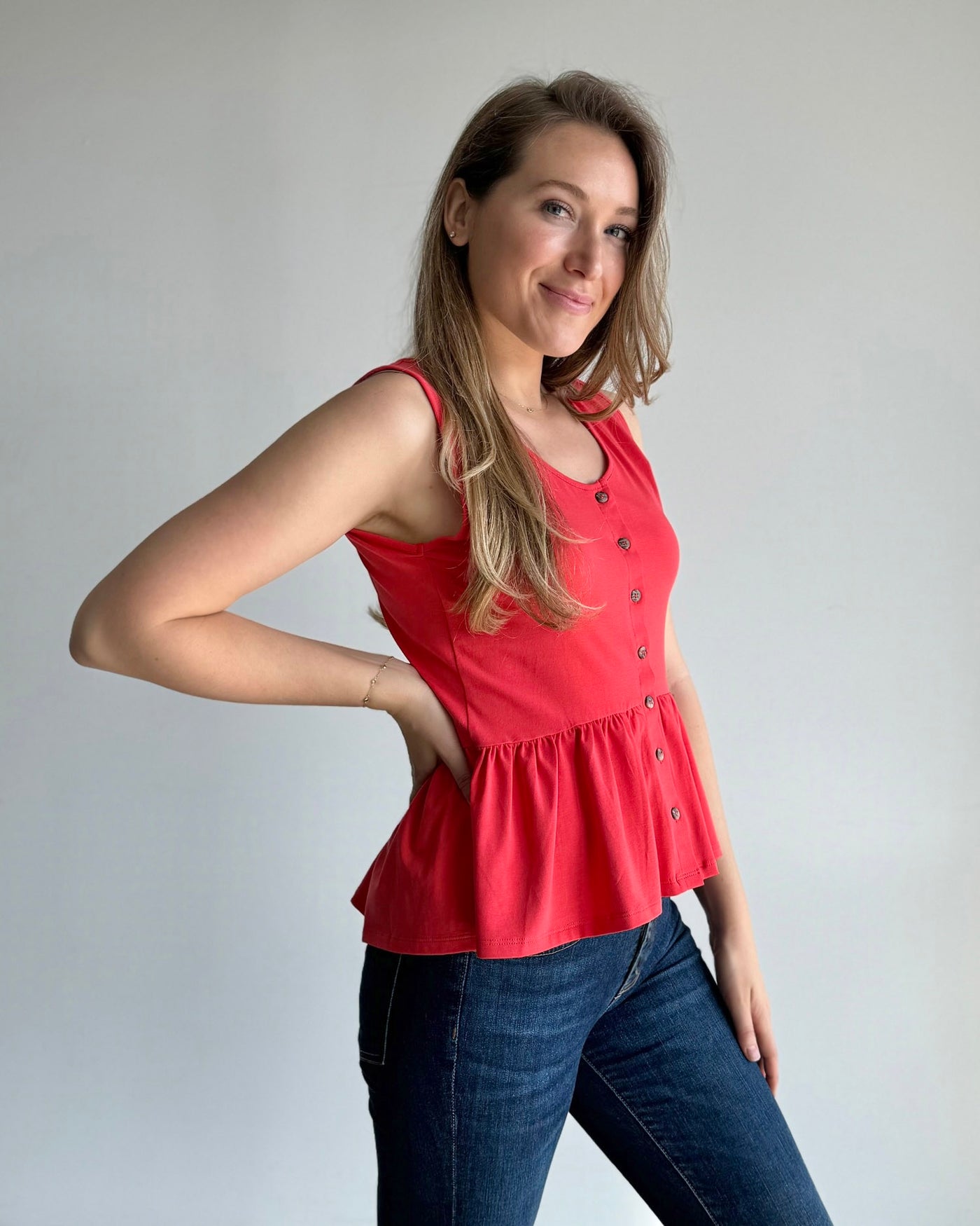 BARI peplum tank in Coral Red