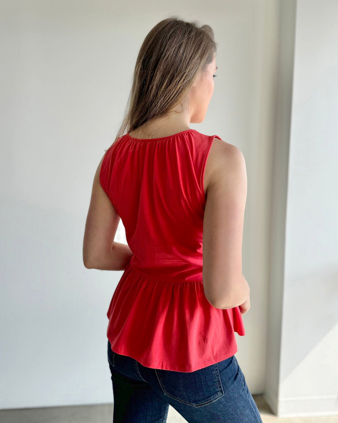 BARI peplum tank in Coral Red